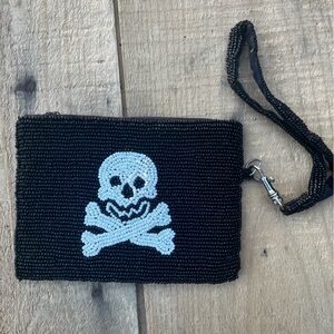 Super cute black beaded skull and crossbones wristlet